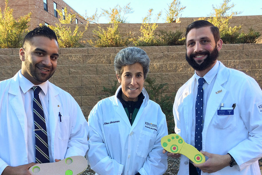 Kent State University students Nilin Rao (left) and Craig Verdin (right), and Exercise Science and Physiology Professor Ellen Glickman, Ph.D. (center), have invented an insole to help people with ulcerations on their feet.