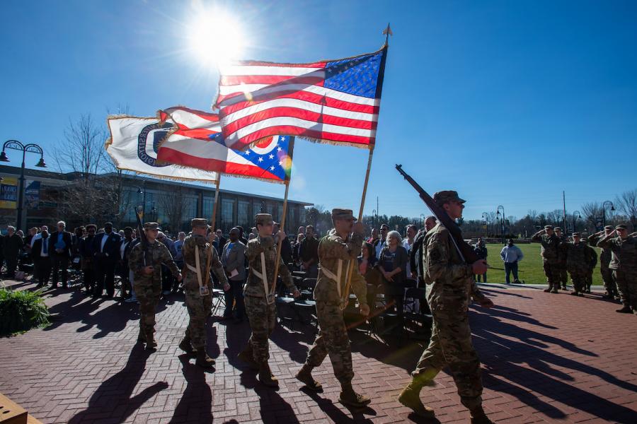 Soldiers marching in line at Veteran's Day event on campus