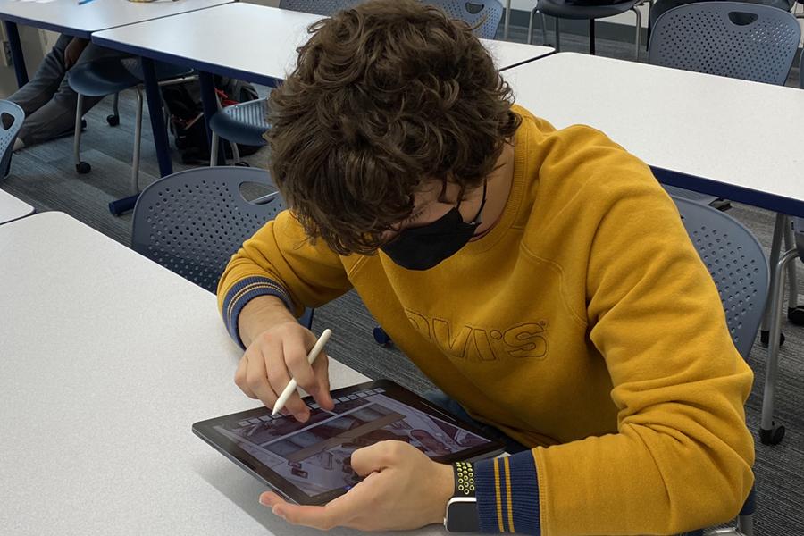 Student works on iPads