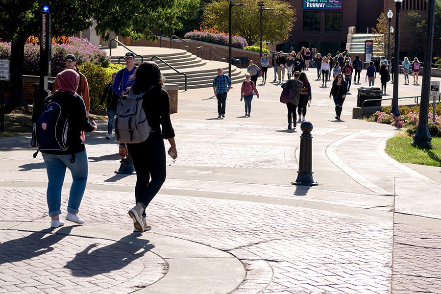 Students walk along the Lester A. Lefton Esplanade on the Kent Campus