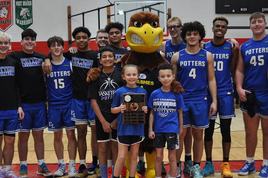 Dean David Dees (far left) presented the County Classic traveling plaque to the East Liverpool Potters, who won this year’s contest over the Salem Quakers.
