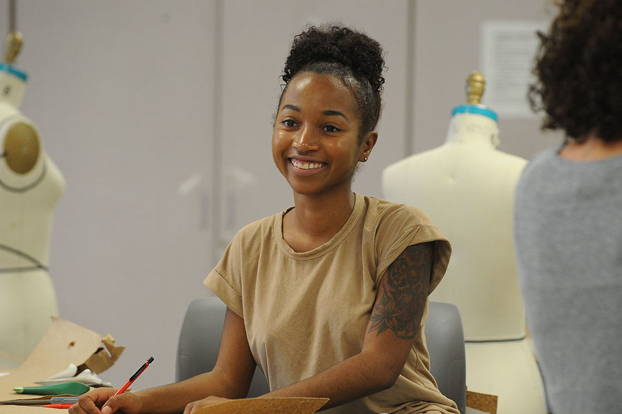 A student in Kent State’s Fashion School works on a project in a design classroom.