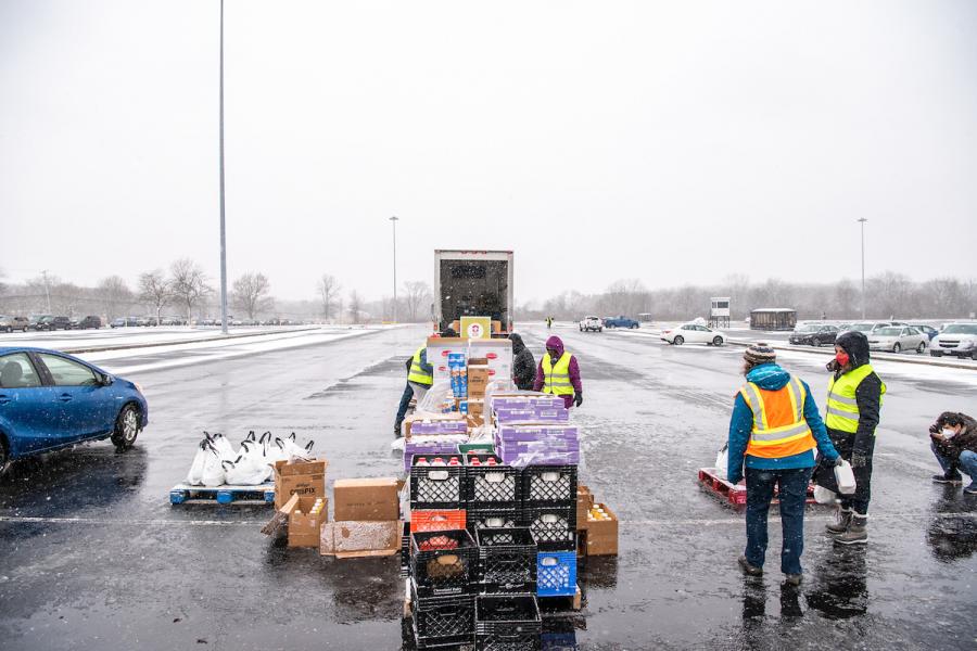 Volunteers from Kent State, the Akron-Canton Regional Foodbank and the National Guard assisted more than 200 families during the snowy  drive-through food distribution event on Wednesday at Dix Stadium. 