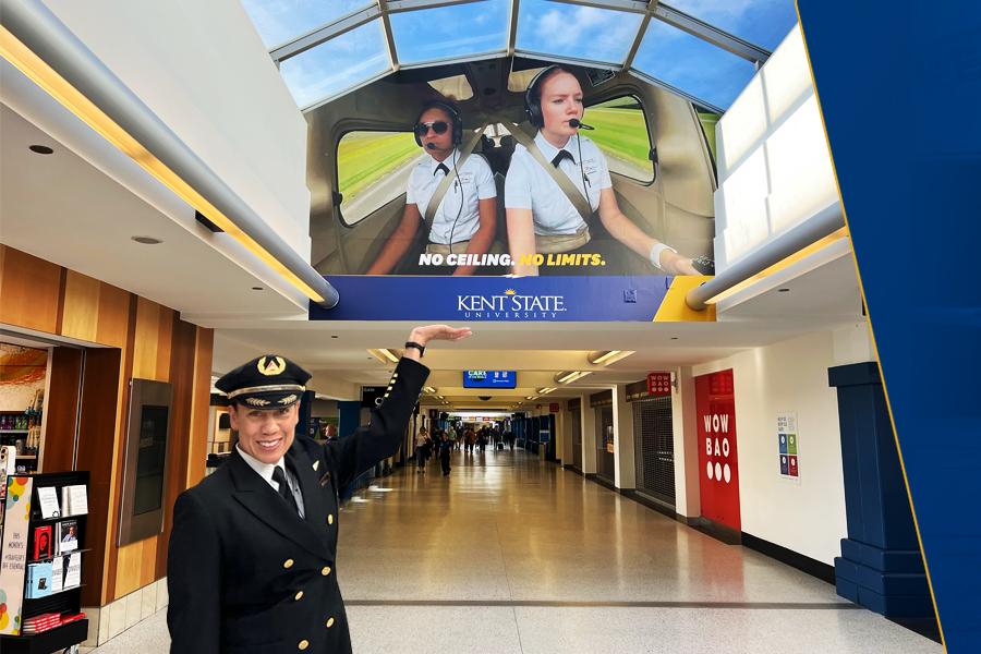 Stephanie Johnson Gestures at Airport Advertisement Featuring Her Daughter Alex Johnson (left) and  Laura Wilson