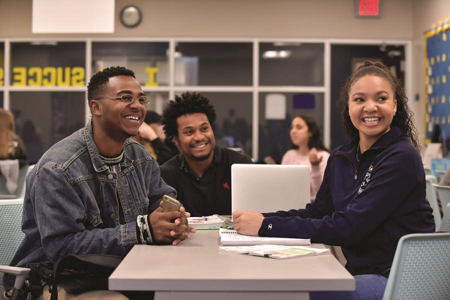 Three Kent State University students work together in a study group.