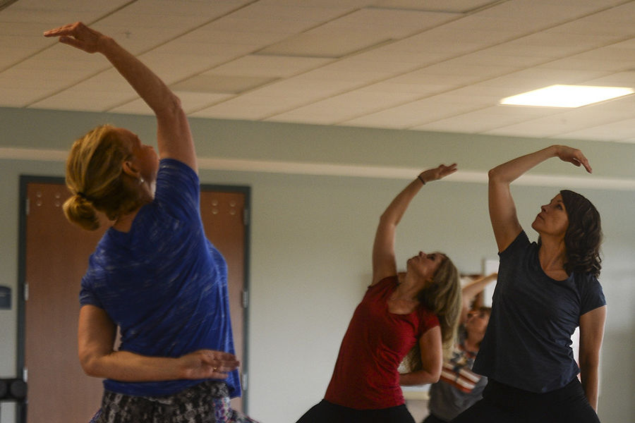 Kent State University employees participate in the Lunchtime Rejuvenation Yoga session – a regular wellness offering on Tuesdays and Thursdays.