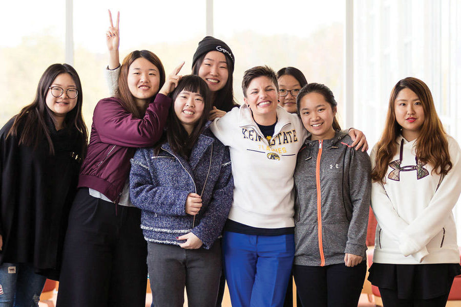 Sarah Schmidt (front row, third from right), outreach program coordinator for global education initiatives at Kent State University at Stark, focuses on expanding opportunities for students.