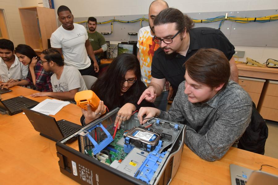 photo Computer Engineering Technology faculty member Evren Koptur instructs students