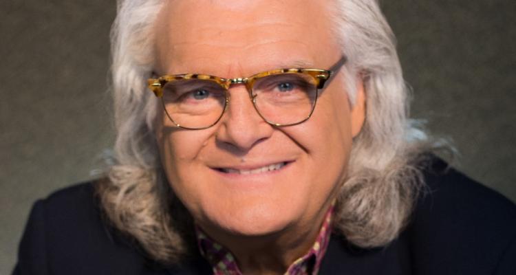 picture of Ricky Skaggs in red and white plaid shirt and black jacket