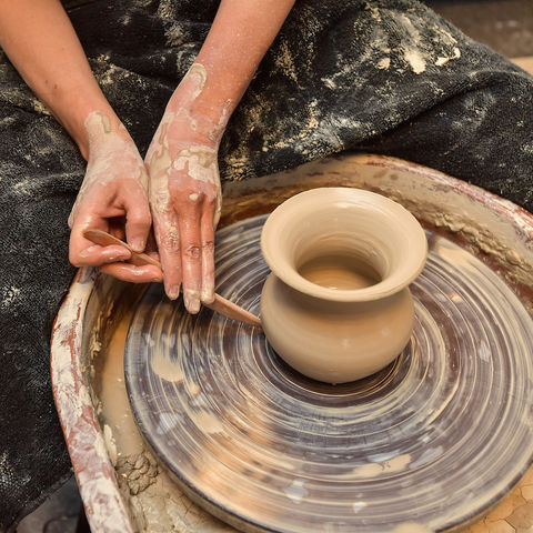 Doctoral Student Michelle Bebber works at the Eren Lab's pottery wheel