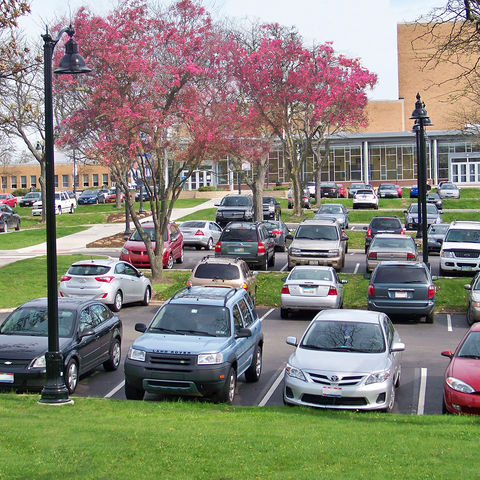 Cars line the parking lot behind the Music and Speech Center
