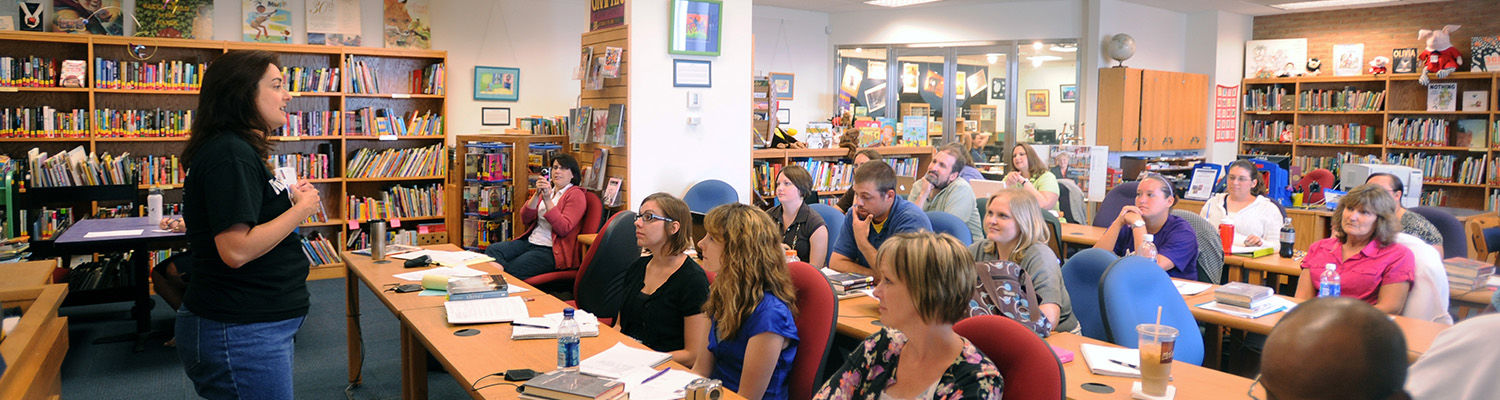 Local teachers present findings during a conference in the Reinberger Children’s Library Center in the Kent State University Library.