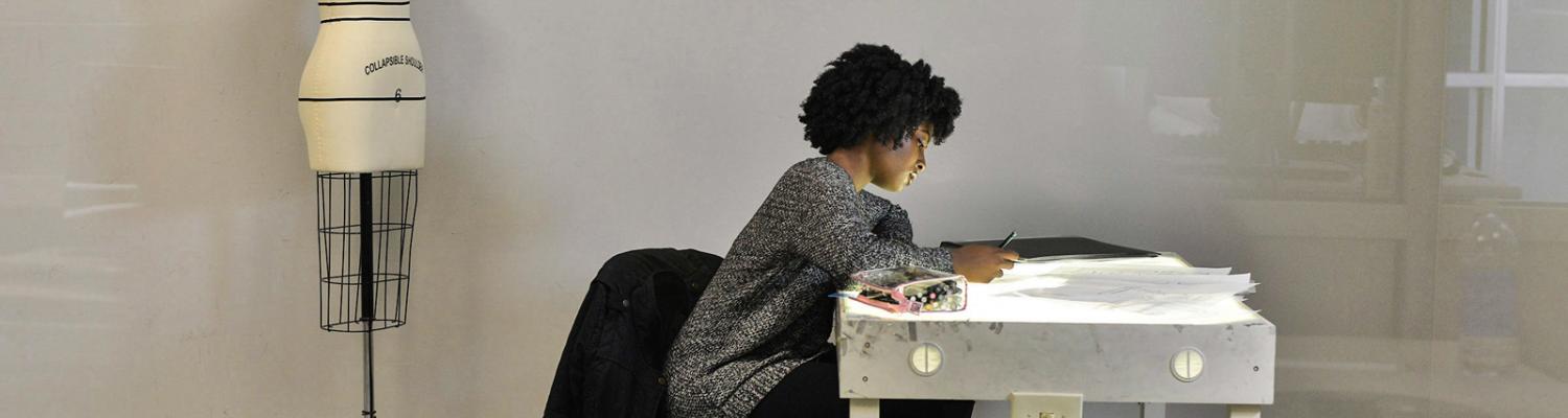 A fashion student works in Rockwell Hall