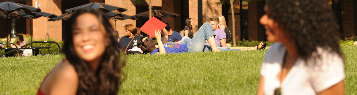 Student on Lawn Reading