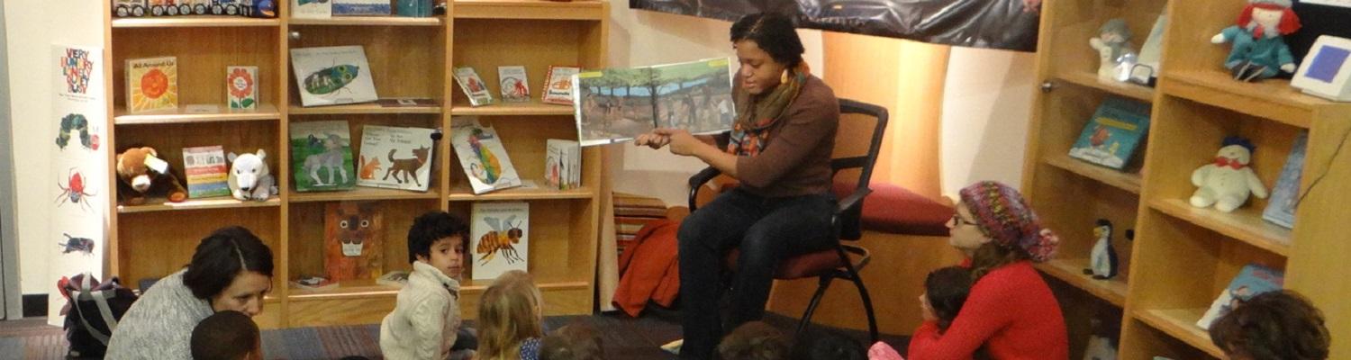 MLIS student reading to children at the Reinberger Children's Library Center at Kent State University