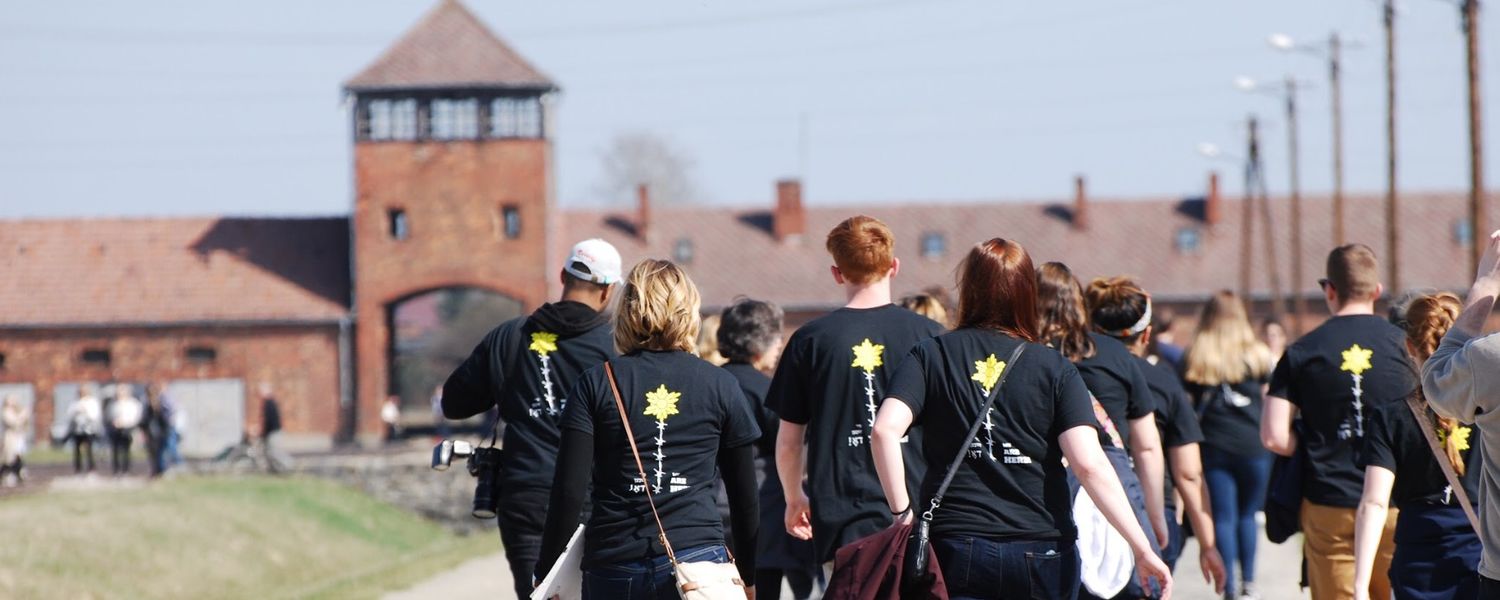 Students walking through Auschwitz