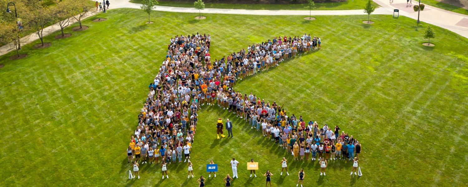 The class of 2023 forms a K on Manchester Field. 