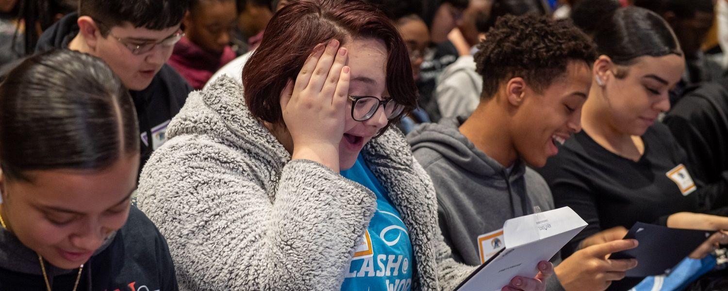 Students from the LeBron James Family Foundation’s I PROMISE Network react to learning that Kent State University will offer eligible students free tuition for four years and free room and board for one year.