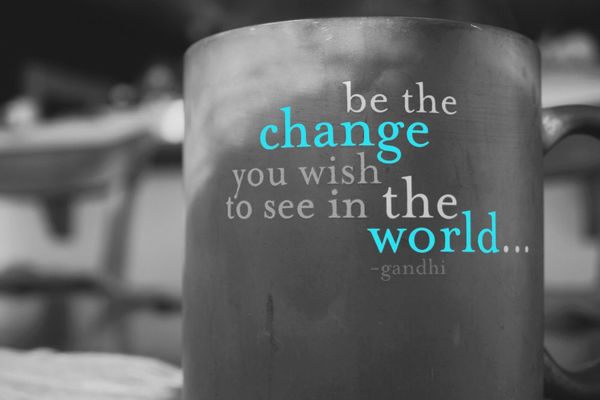 Image of a coffee mug with the text "be the change you wish to see in the world... ~ghandi