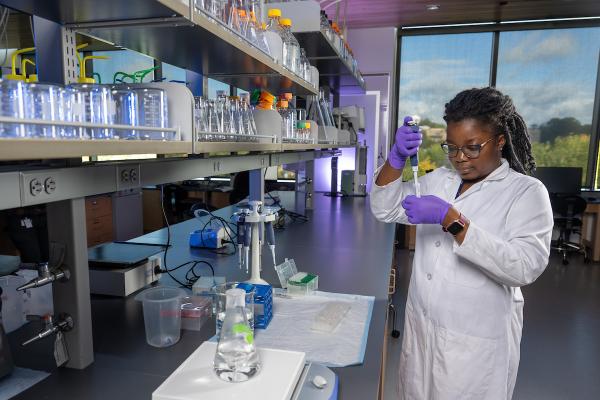 Kent State graduate student Thywill Ettey, a third-year doctoral student in the School of Biomedical Sciences, conducts laboratory research.