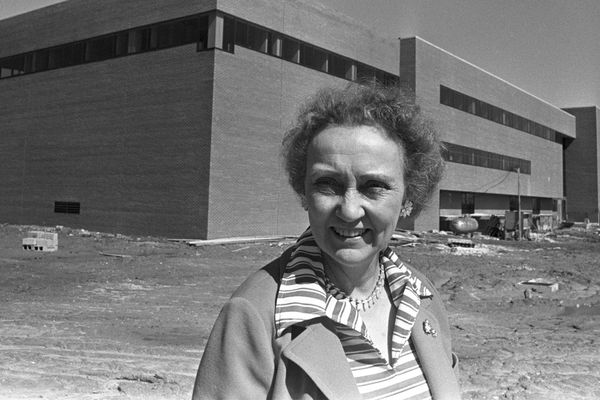 Linnea Henderson, founding Dean of the School of Nursing, standing in front of the nursing building, her namesake.