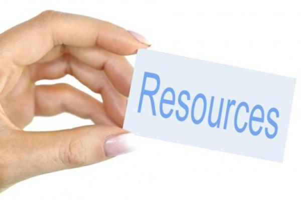 hand with sign that reads resources