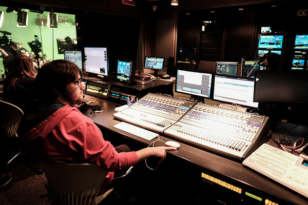 A Student sits in the control room during a TV2 broadcast