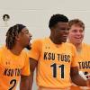Three Golden Eagles men's basketball players celebrating a win