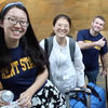 International students smile for the camera as they arrive to a warm welcome from Kent State volunteers.